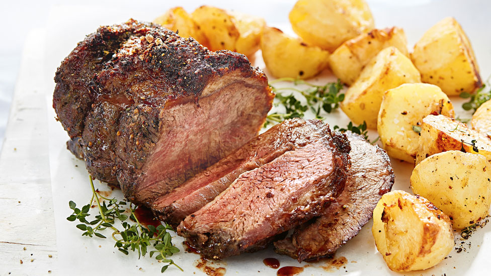 Roast beef served with potatoes